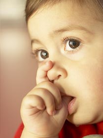 stock photo of baby sucking her thumb